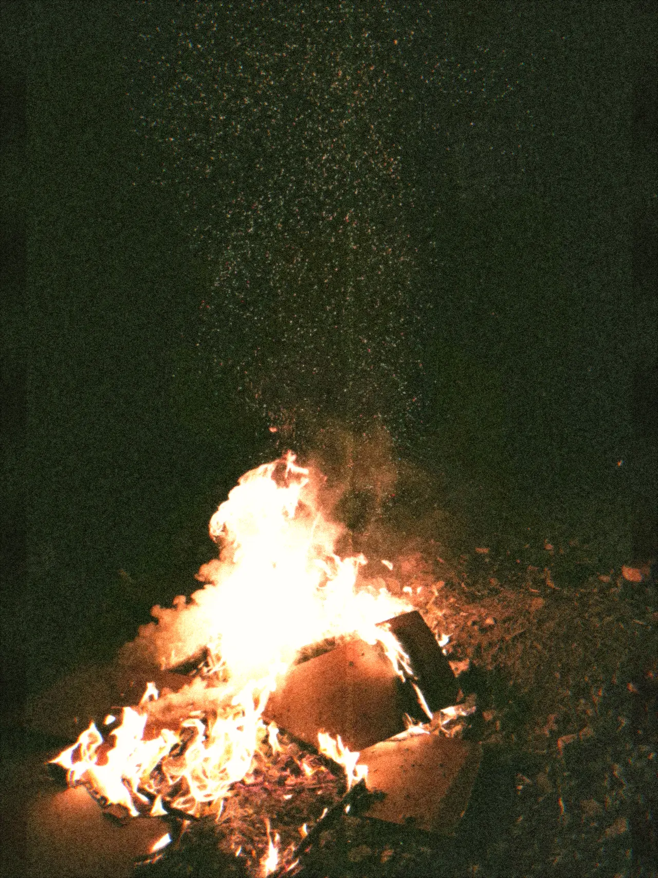 Bonfire sparks on grainy Super 8 home-movie film — Super 8