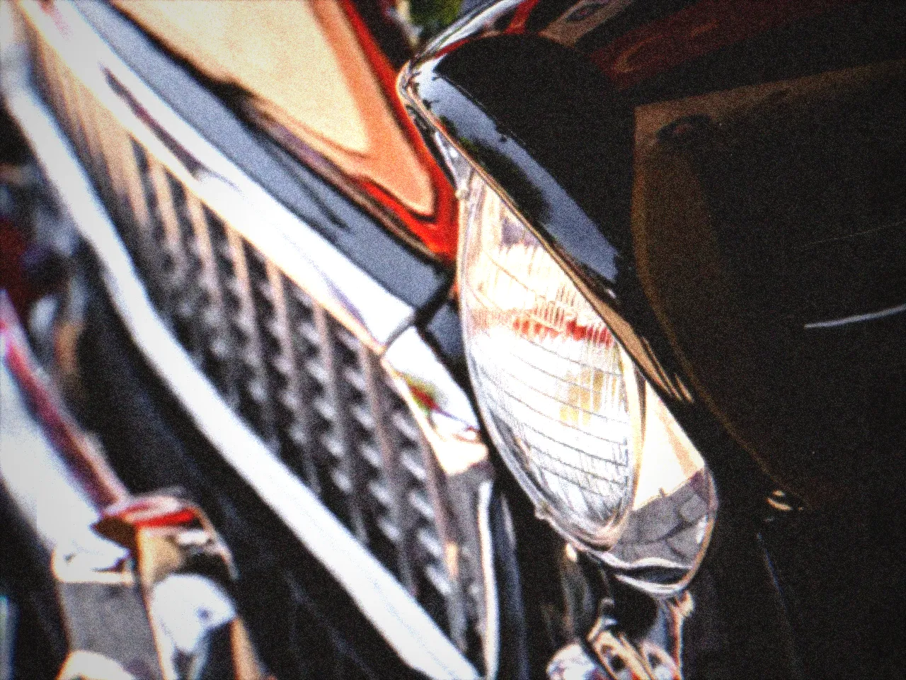 A chrome car grille on warm Kodachrome reversal stock — Kodachrome