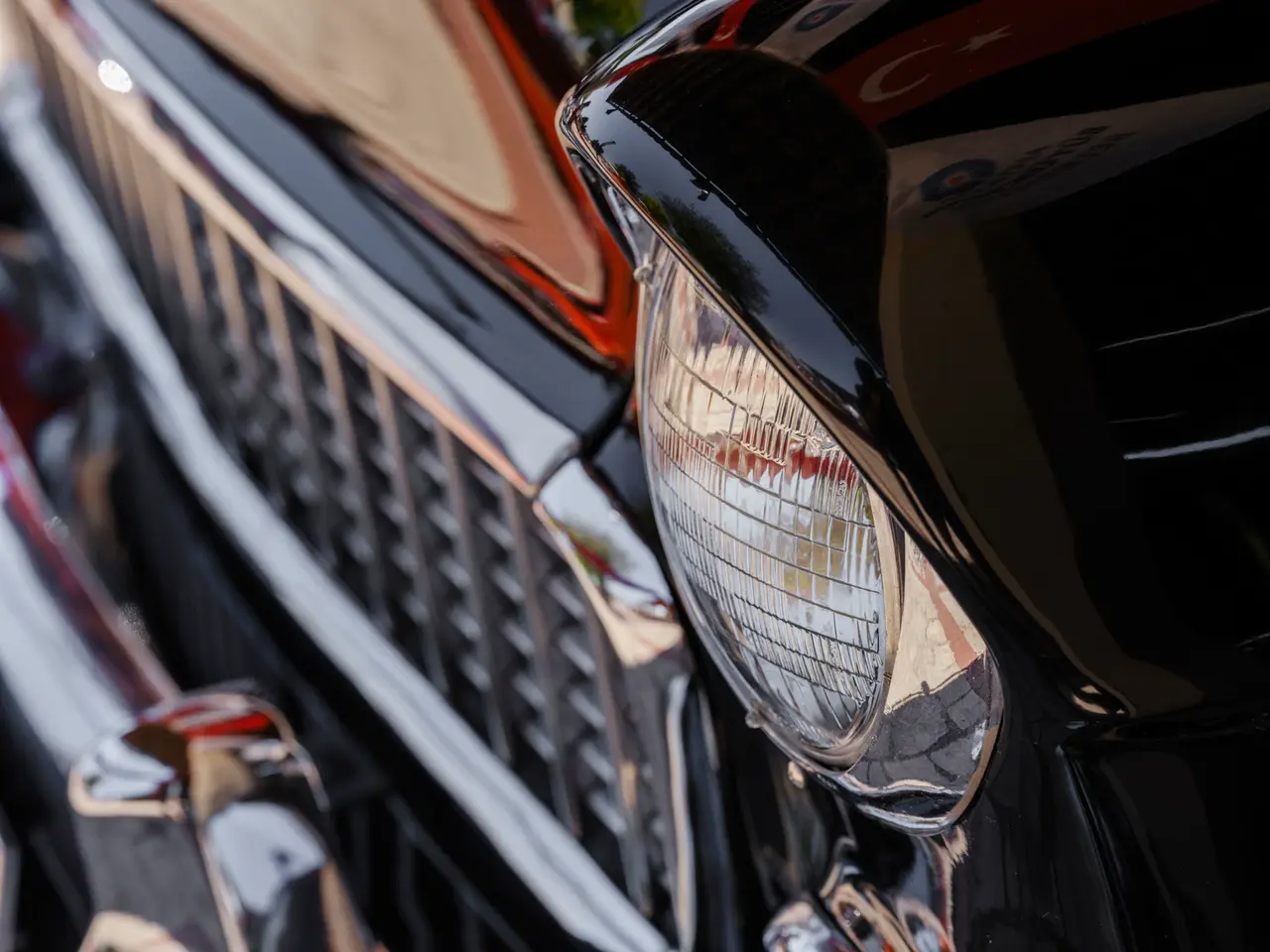 A chrome car grille as a high-contrast nitrate newsreel — Original